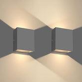 Warm white LED wall light on modern UK home exterior